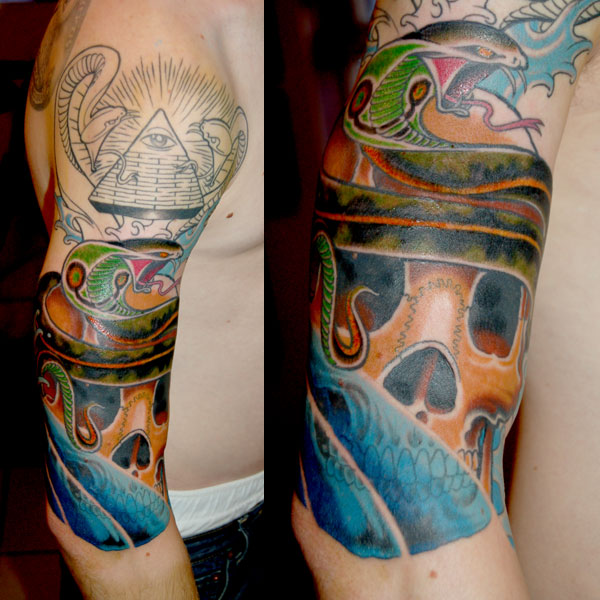An interesting way to enrich the basic scale tattoo is to add the image of